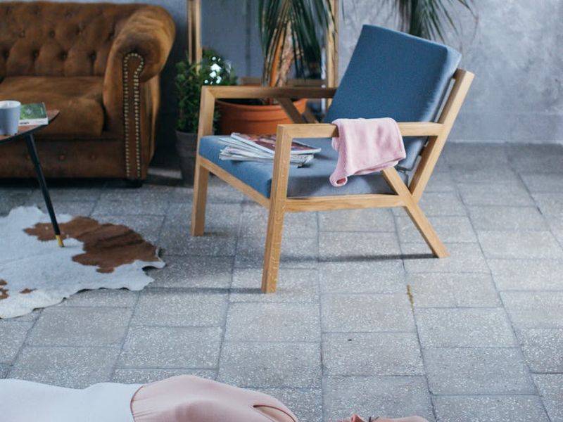 Detailed shot of a yoga mat and blocks in a sunlit room
