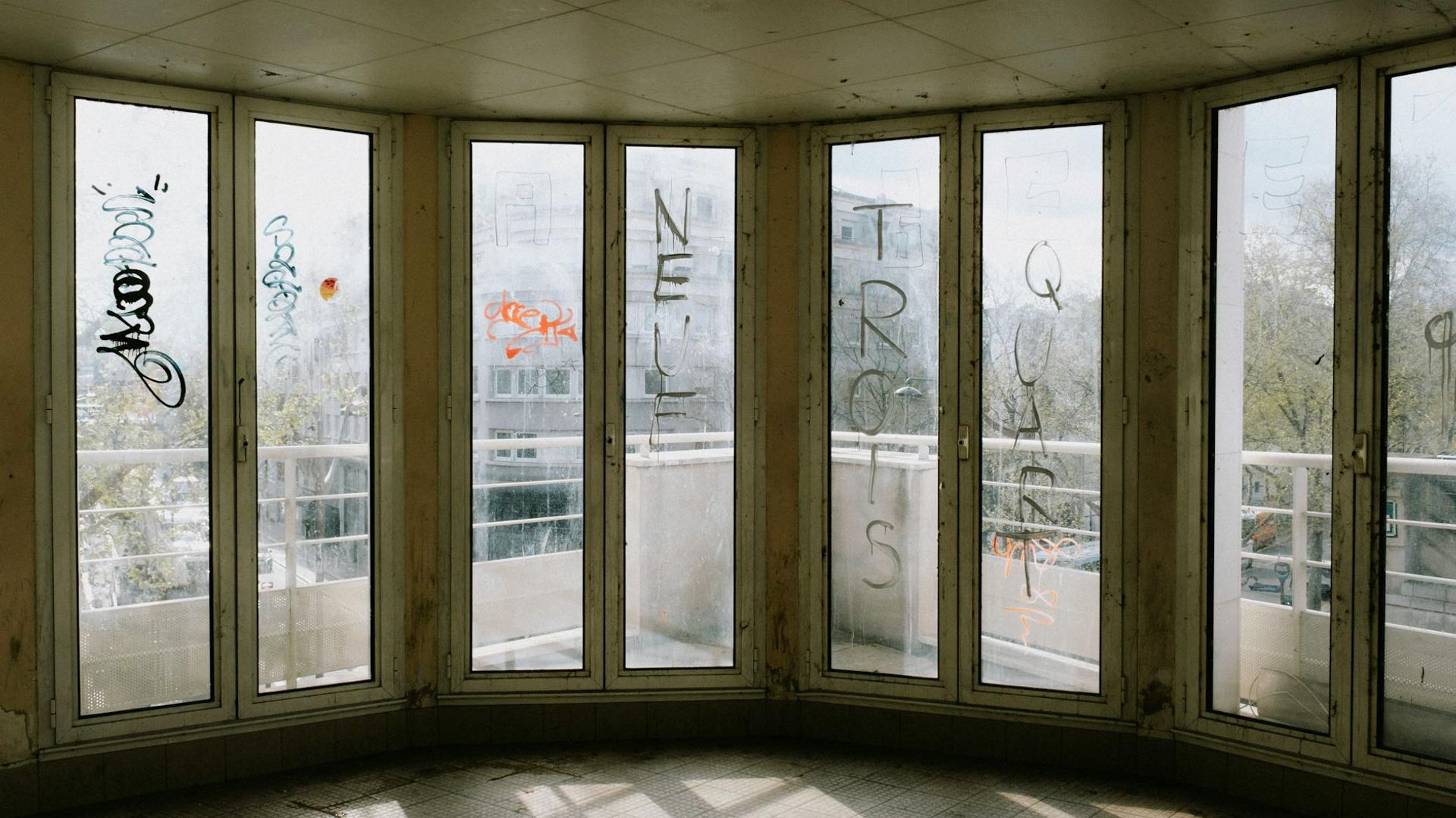 Minimalist yoga studio with warm sunlight streaming through windows